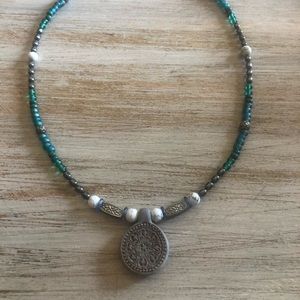 Teal (greens and blues) with clay pendant